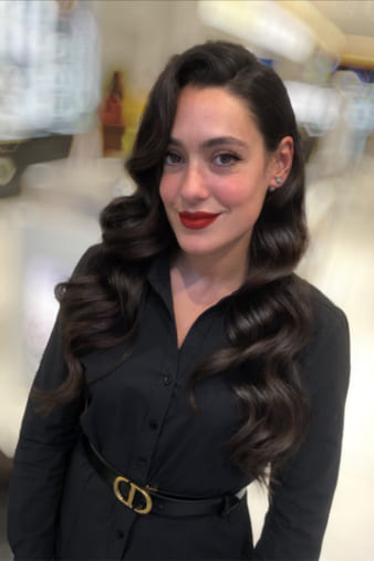 Client with long brown hair, dry-styled into sleek Hollywood waves.